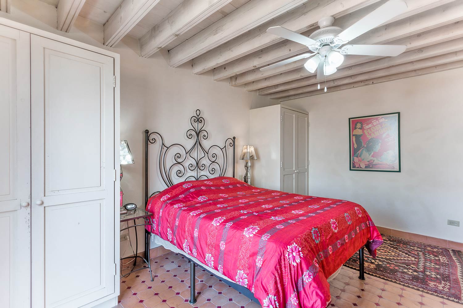 Photo of Casa de la Vista Third Floor Master Bedroom With Ceiling Fan and a Wardrobe on Each Side of the Bed
